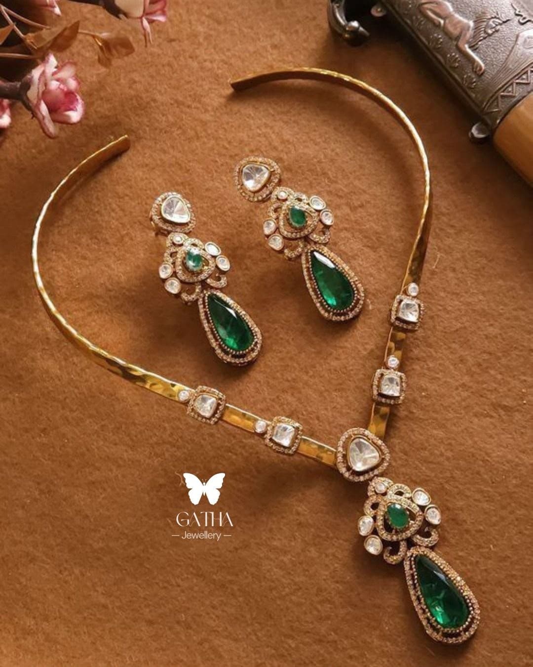 Emerald Drop — A hammered collar with a long green drop, and earrings cut to the same line.