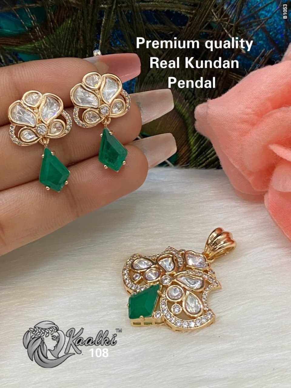 Emerald Kite — A kite-cut green stone hanging from a cluster of uncut petals.