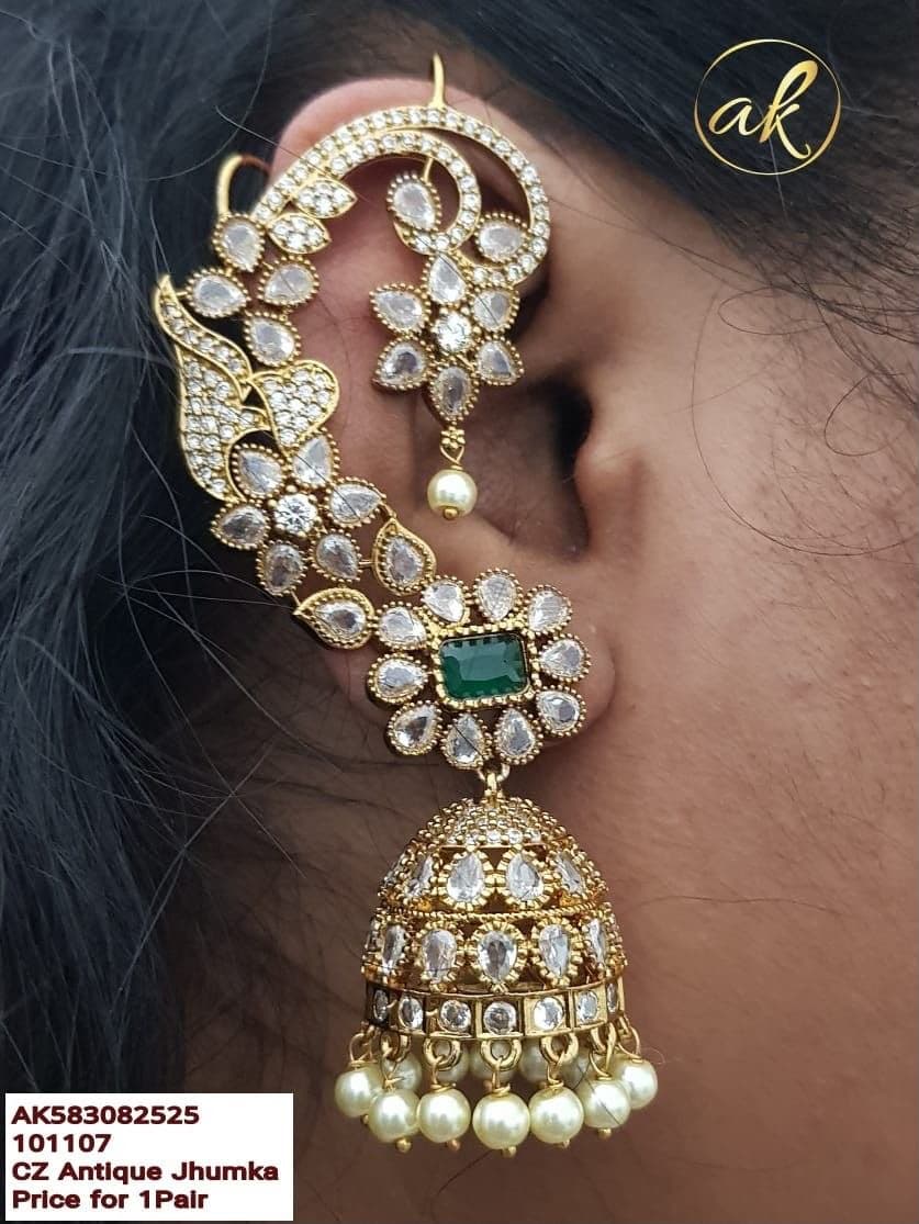 Kundan Ear Cuff — A stone-set cuff that traces the ear down to a pearl-fringed jhumka.