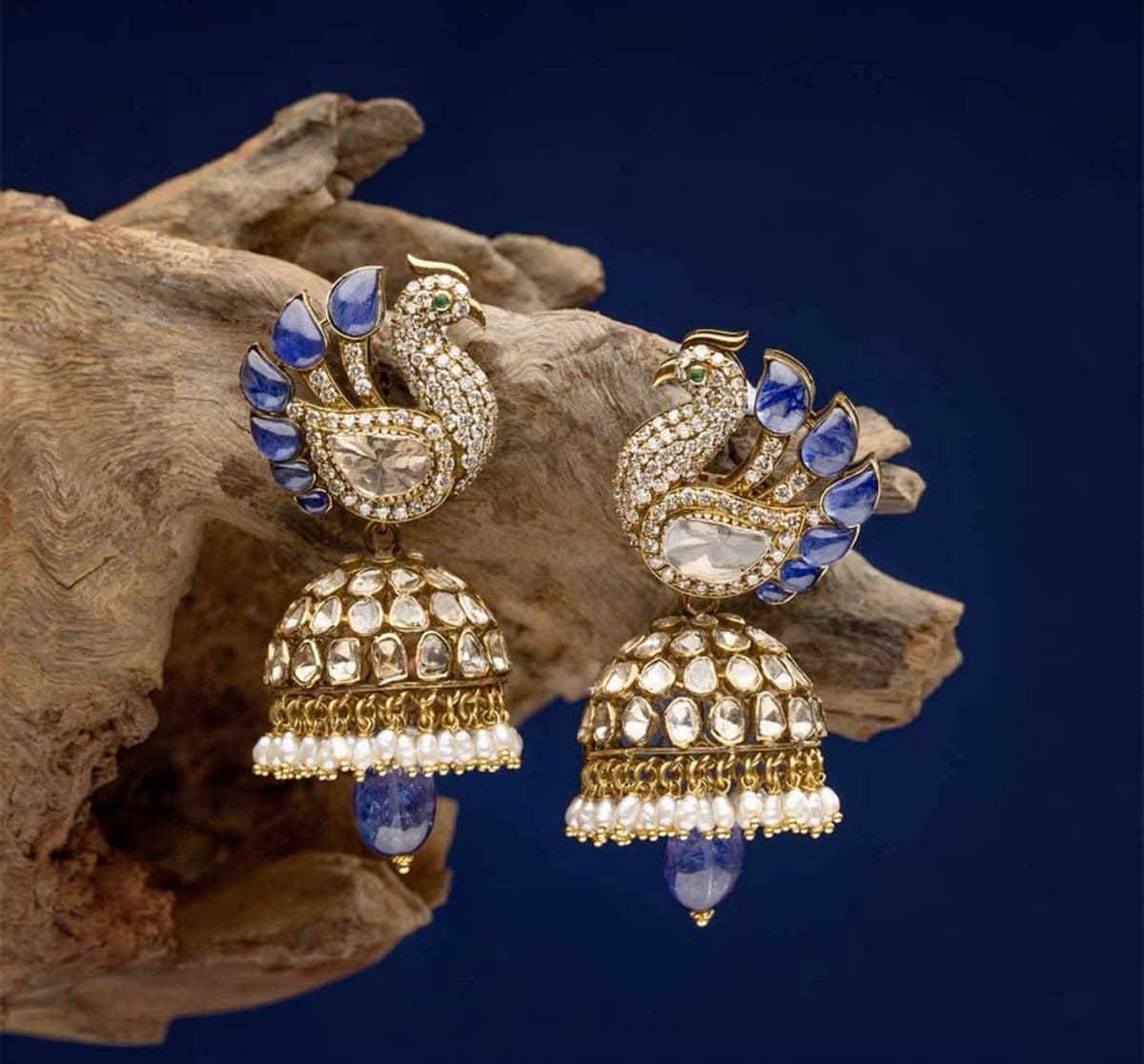 Nilkanth Jhumka — A blue-tailed bird above a dome of uncut stones, finished with a pearl fringe and a single cool drop.